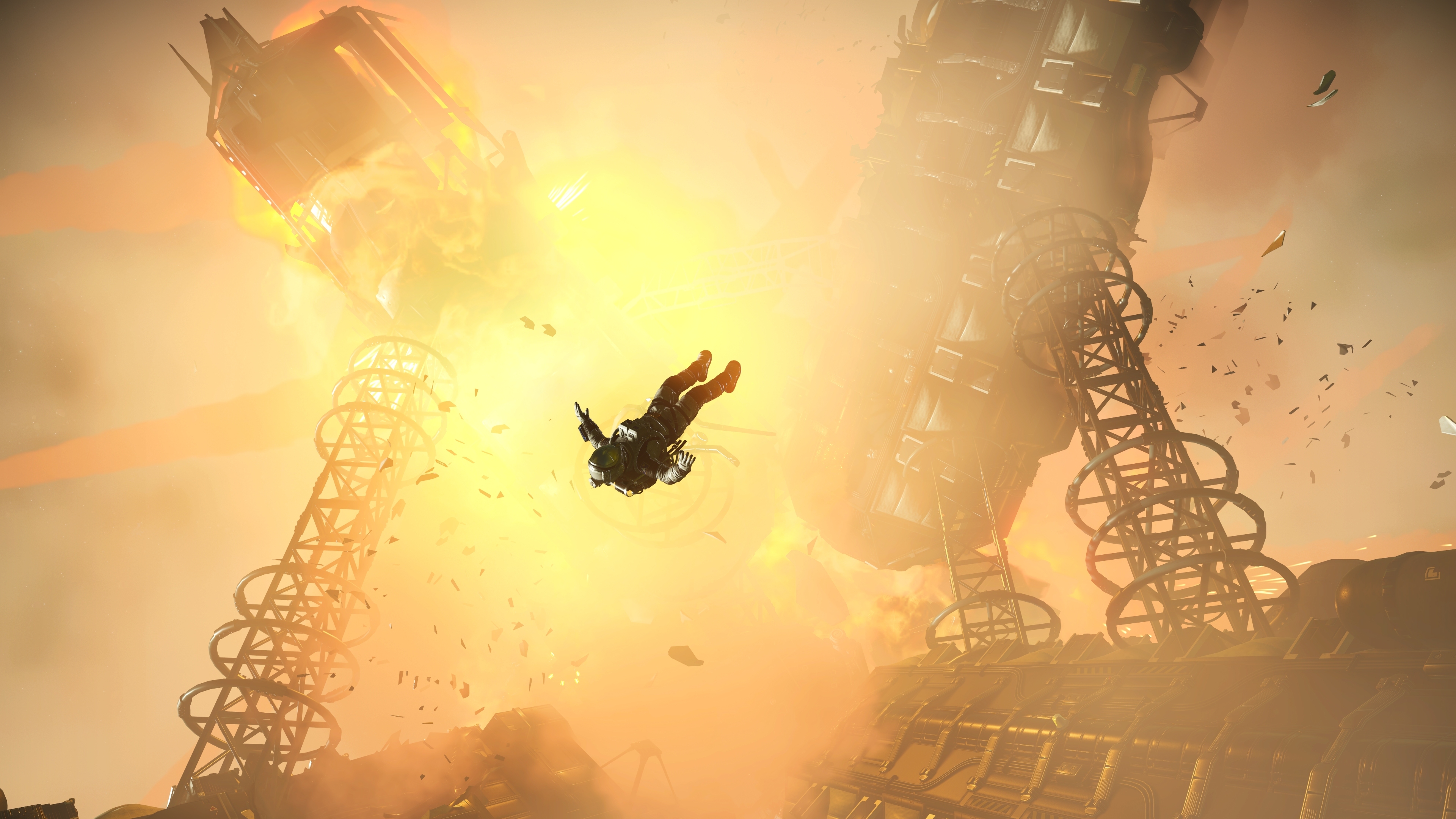 A No Man's Sky astronaut spacewalks clear of an exploding derelict space hulk as its lattice towers break apart.